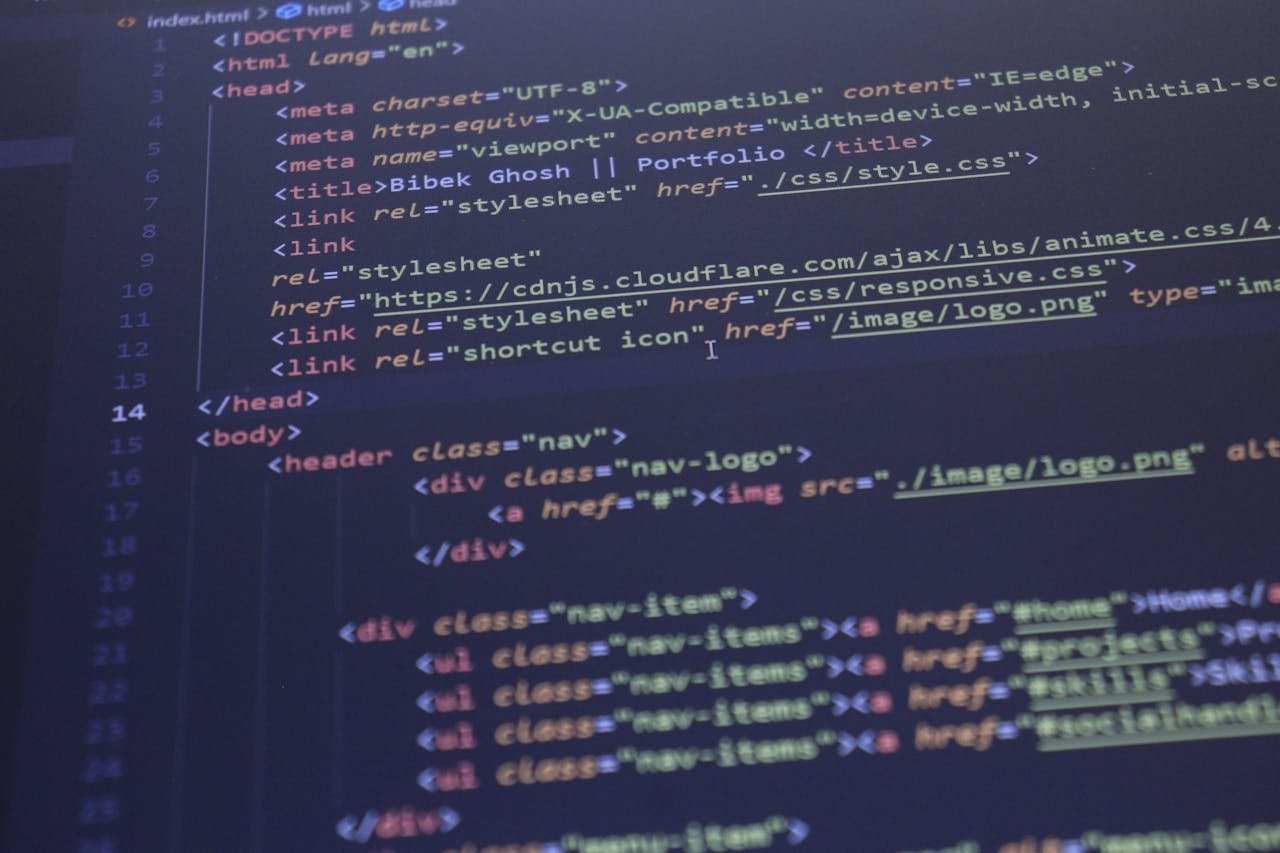 services-01 Close-up view of HTML and CSS code displayed on a computer screen, ideal for programming and technology themes.