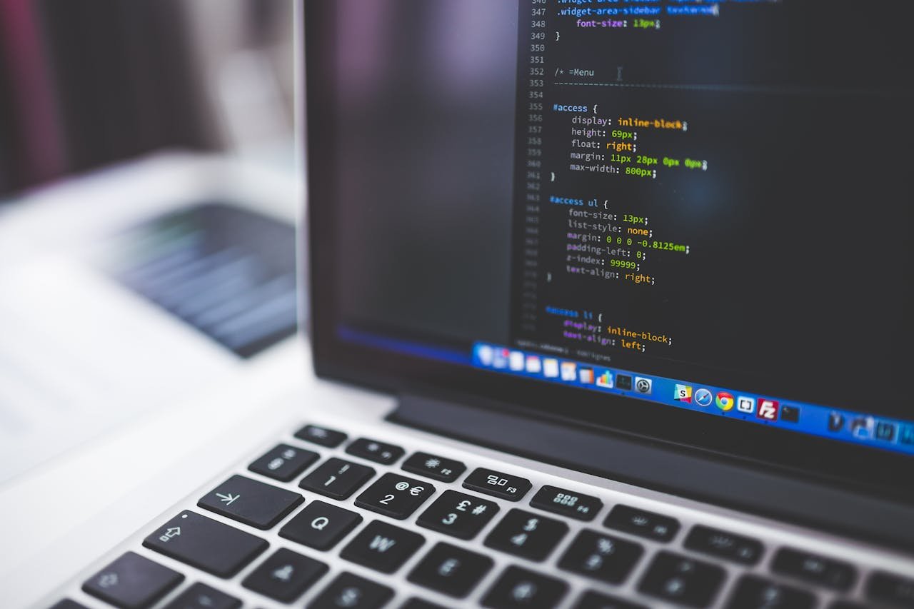 about-us Laptop screen displaying code, perfect for tech-focused projects.